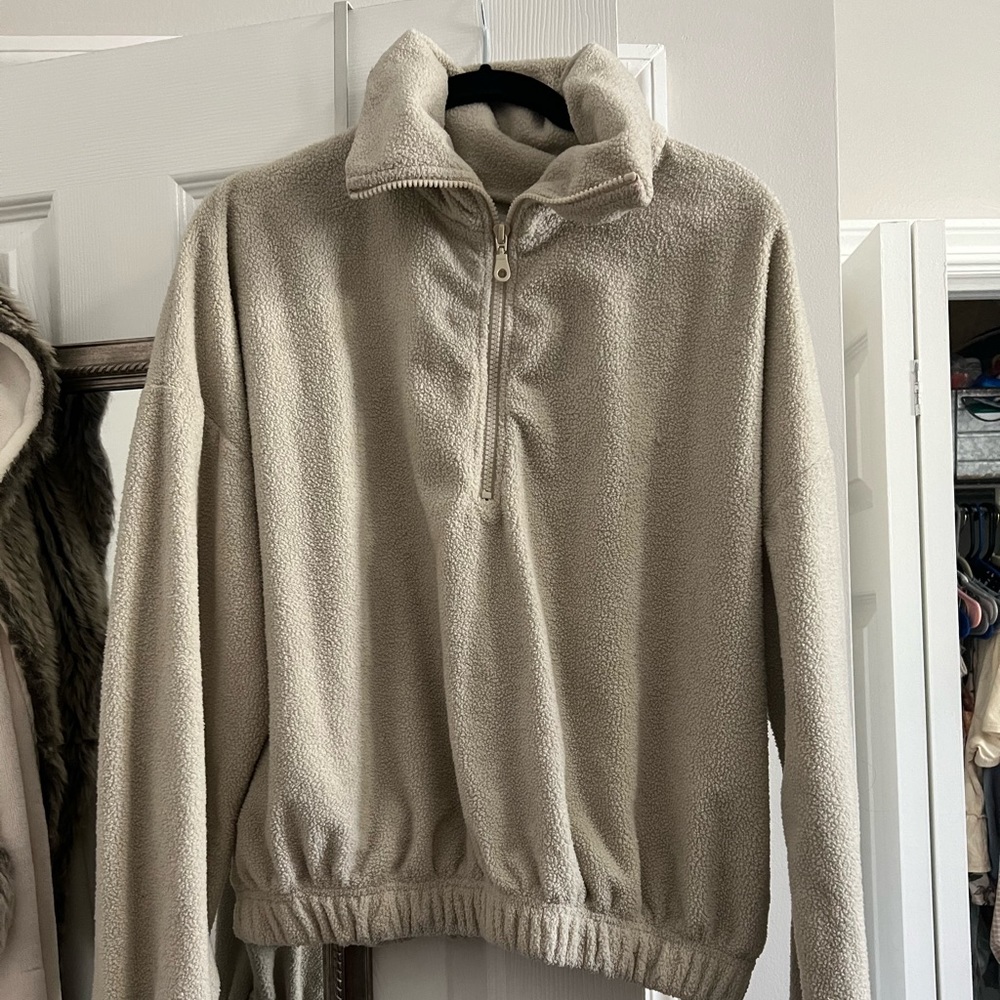 Light tan fuzzy pullover half zip crop sweatshirt